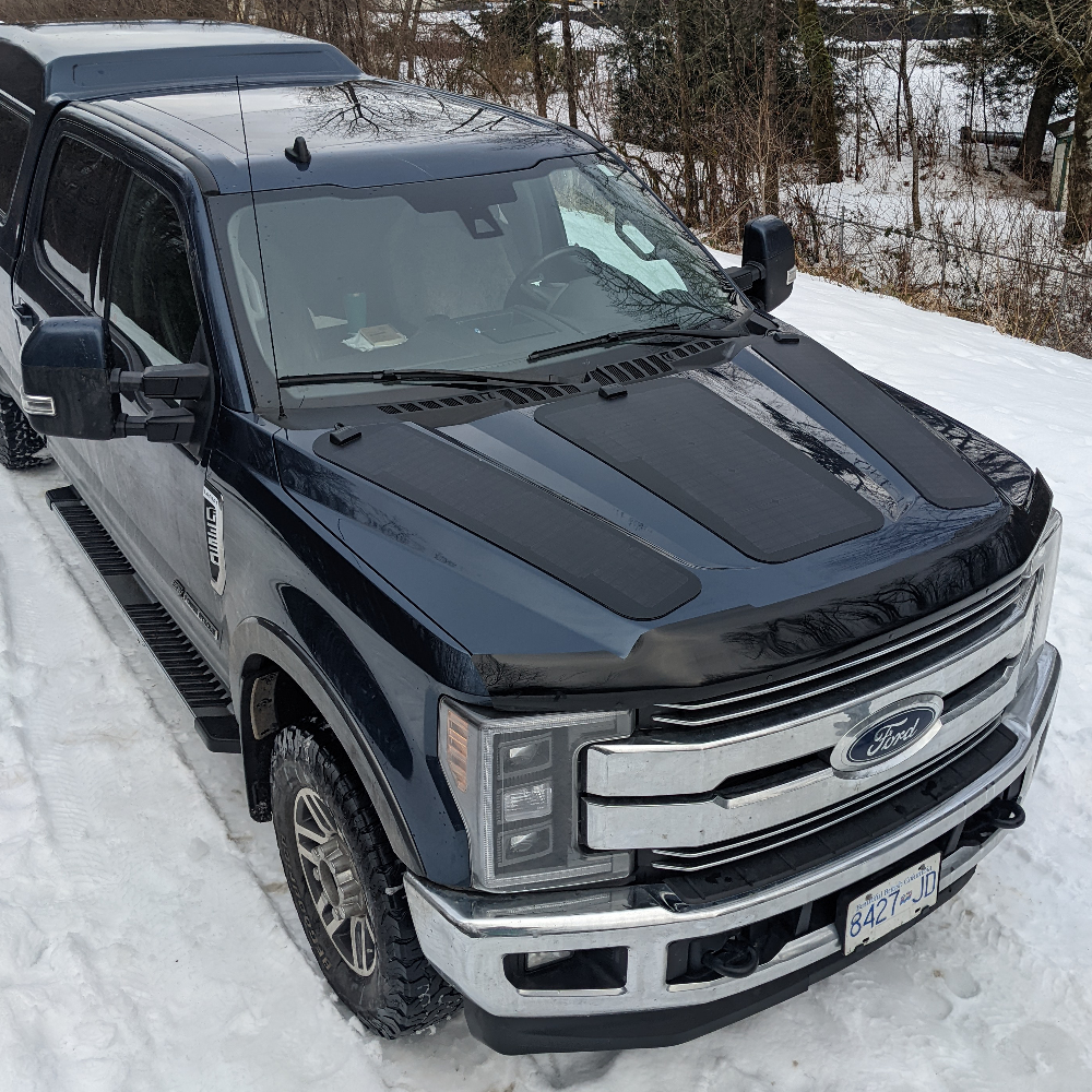 The Cascadia 4x4 VSS System hood solar panel module system for the ford super duty (f250,f350, f450, f550). Shown here in the snow in Squamish, BC